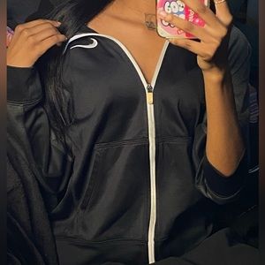 Black and white zip up nike hoodie.Size large in boys. Fits small women as well.